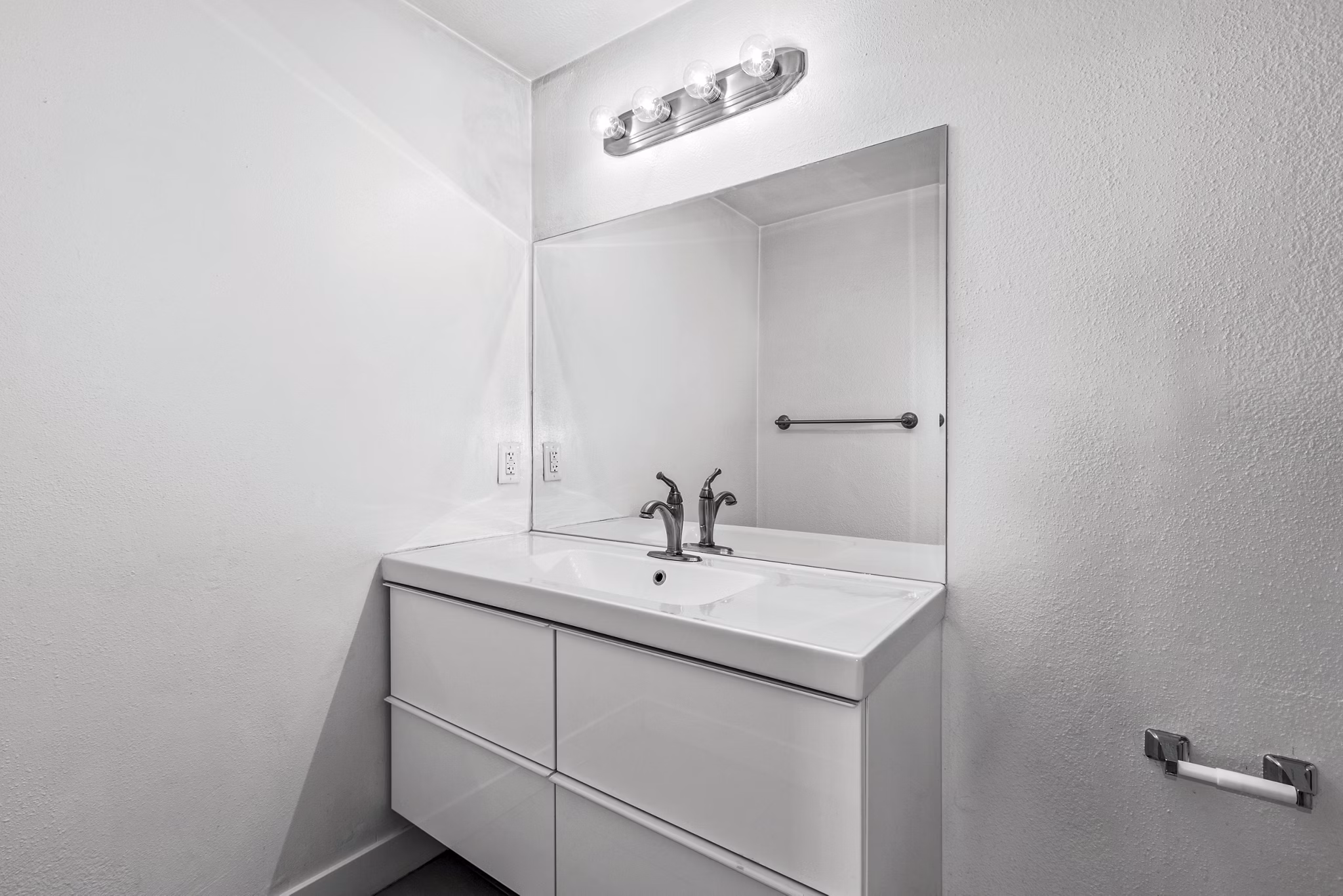 Bathroom with modern fixtures and sleek vanity in Cahuenga Heights Apartments