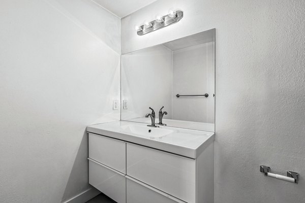 Bathroom with modern fixtures and sleek vanity in Cahuenga Heights Apartments