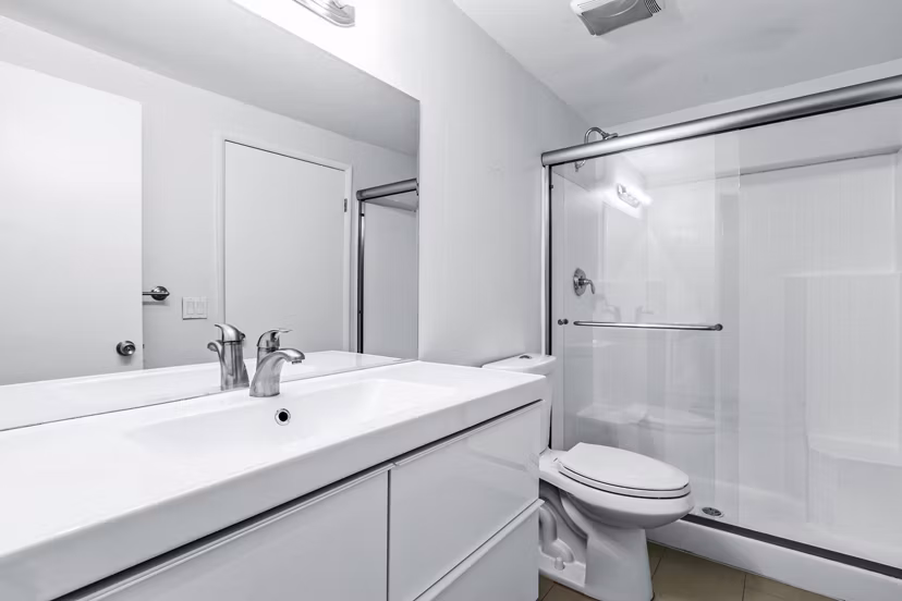 Bathroom featuring sleek fixtures and marble countertops in Cahuenga Heights Apartments
