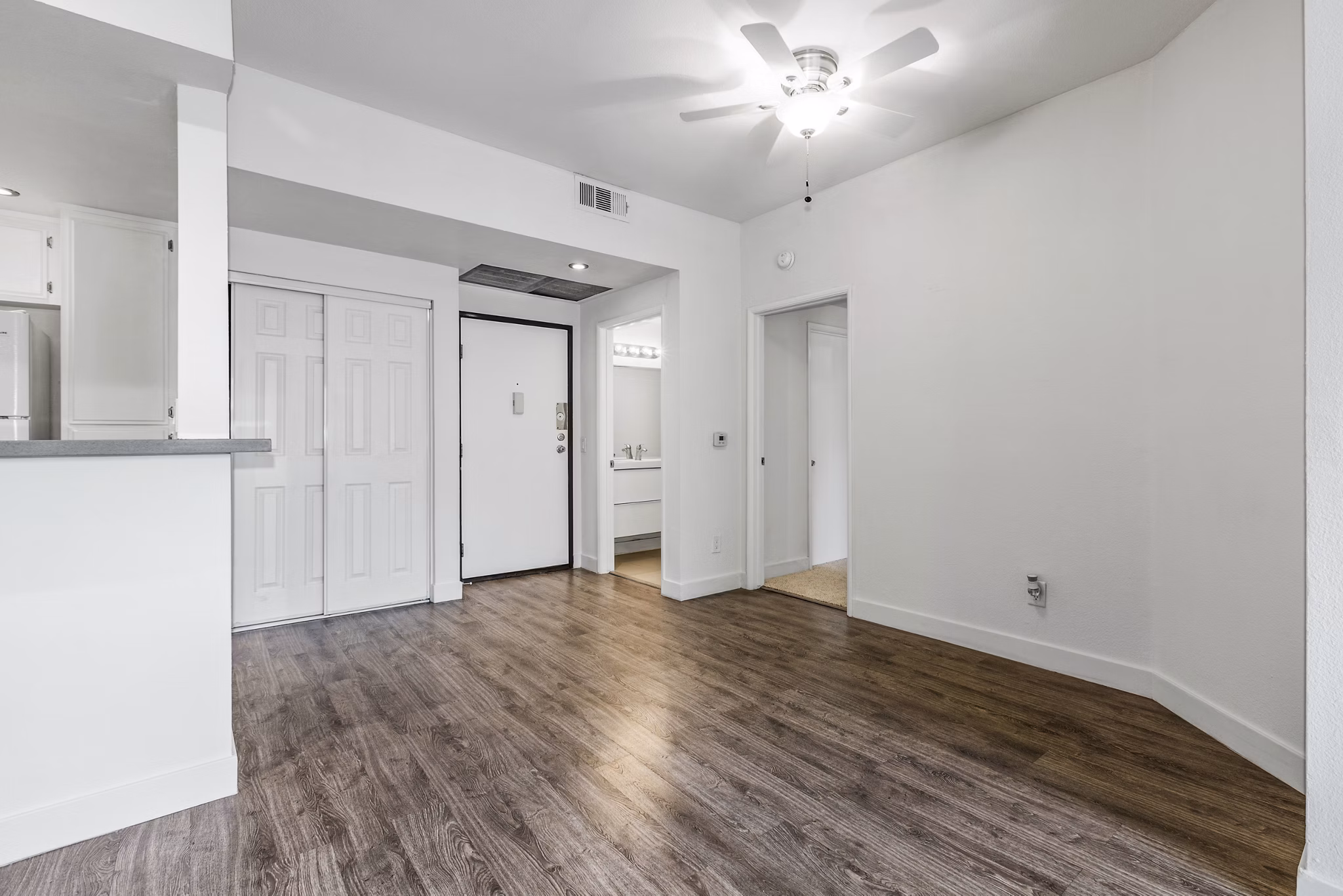 Entrance dining area with modern decor at Cahuenga Heights Apartments, featuring stylish dining set and elegant lighting