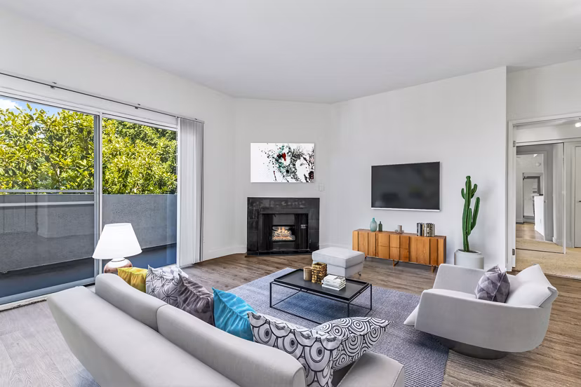 Spacious living room with modern decor in Cahuenga Heights Apartments, offering luxury living experiences