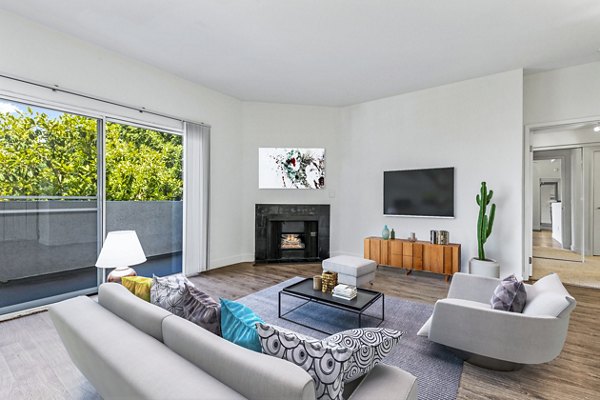 Spacious living room with modern decor in Cahuenga Heights Apartments, offering luxury living experiences