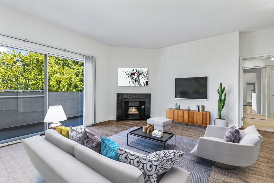 Spacious living room with modern decor in Cahuenga Heights Apartments, offering luxury living experiences