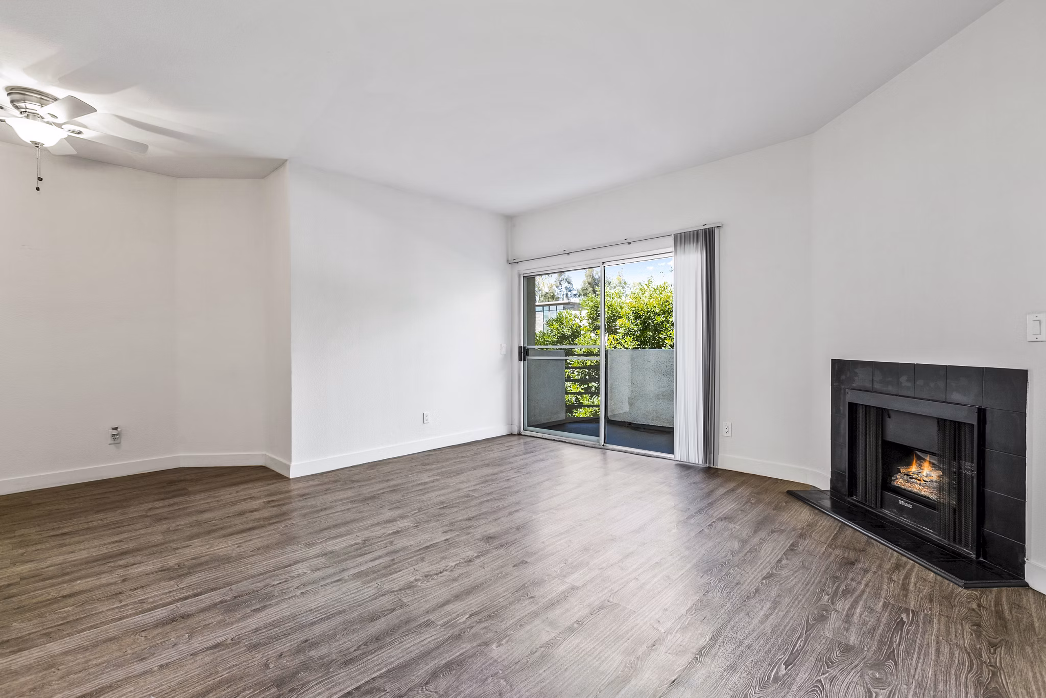 Living room with large windows and modern furnishings at Cahuenga Heights Apartments, offering luxury living in a prime location