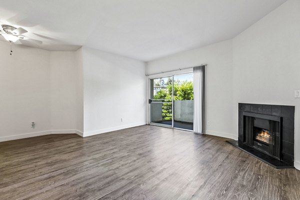 Living room with large windows and modern furnishings at Cahuenga Heights Apartments, offering luxury living in a prime location
