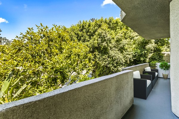 Patio with modern furniture and city views at Cahuenga Heights Apartments
