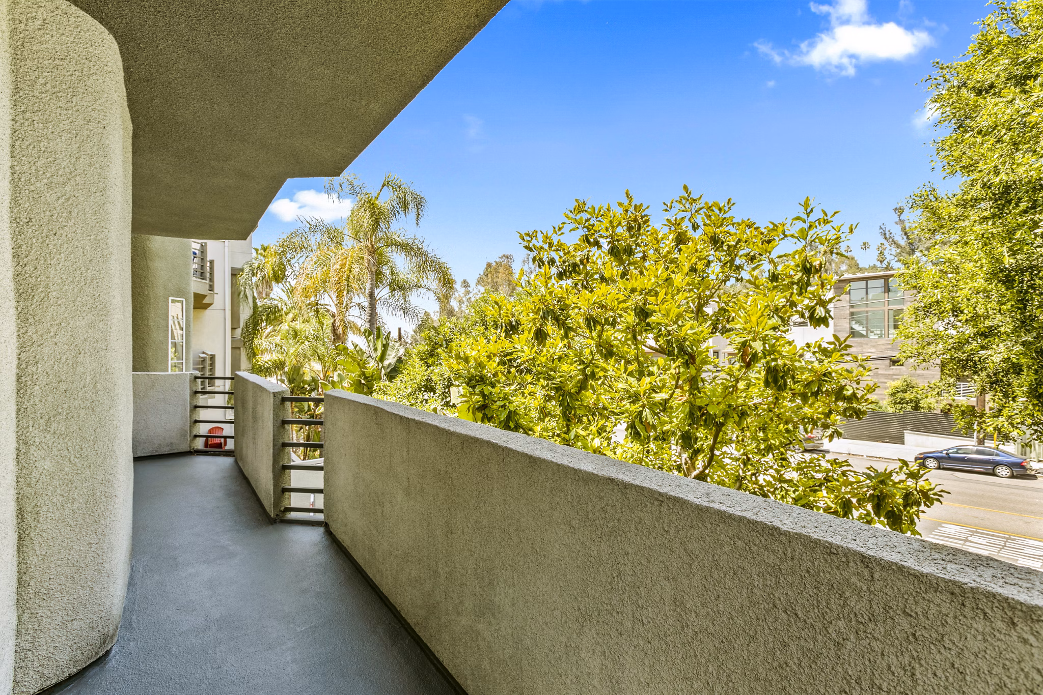 Cahuenga Heights Apartments: Private patio with mountain views, offering relaxation at luxury Greystar residences in Los Angeles