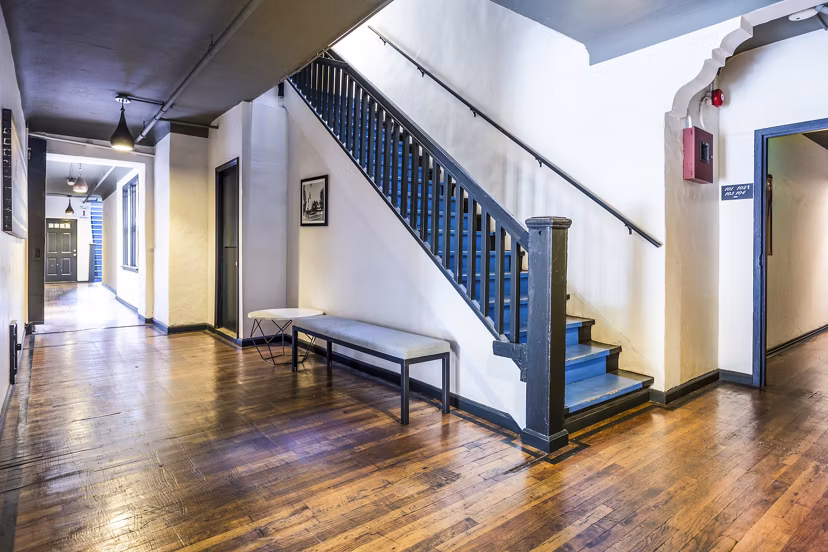 Del Mor Apartments: Elegant clubhouse hallway featuring modern lighting and plush seating