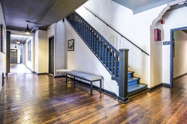 Del Mor Apartments: Elegant clubhouse hallway featuring modern lighting and plush seating