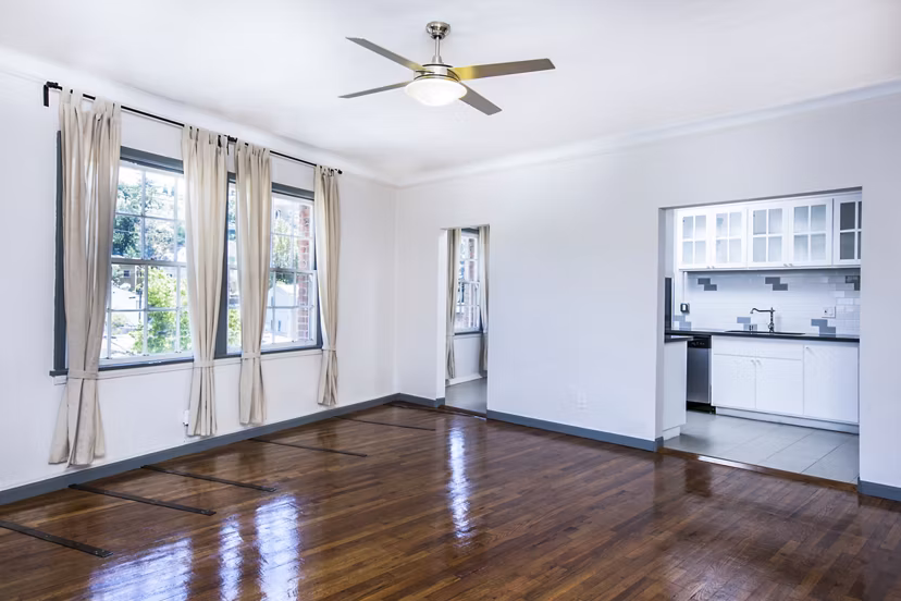 Dining room with contemporary furnishings and elegant lighting at Del Mor Apartments