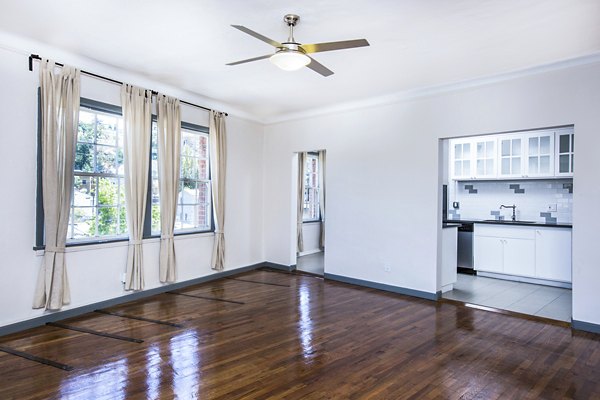 Dining room with contemporary furnishings and elegant lighting at Del Mor Apartments