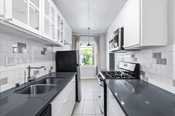 Modern kitchen with stainless steel appliances at Del Mor Apartments, a Greystar luxury apartment community