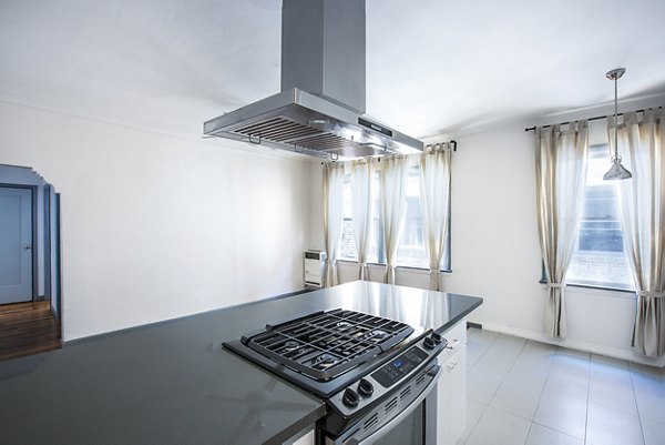 Sleek modern kitchen with stainless steel appliances at Del Mor Apartments