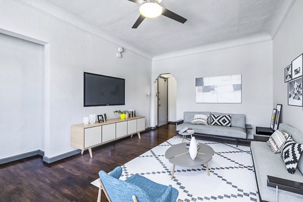 Stylish living room with contemporary decor and natural light in Del Mor Apartments