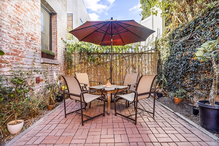 Patio with modern outdoor seating at Del Mor Apartments