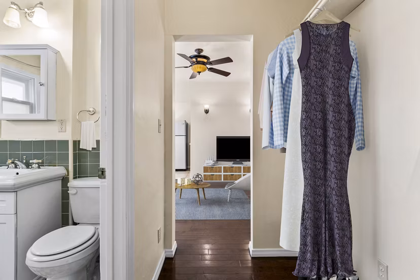 Walk-in closet and modern bathroom at Delta Apartments, luxurious living space in a Greystar luxury apartment community