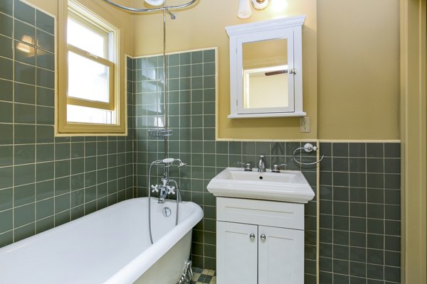 Spacious bathroom with sleek modern fixtures in Delta Apartments, luxury living by Greystar