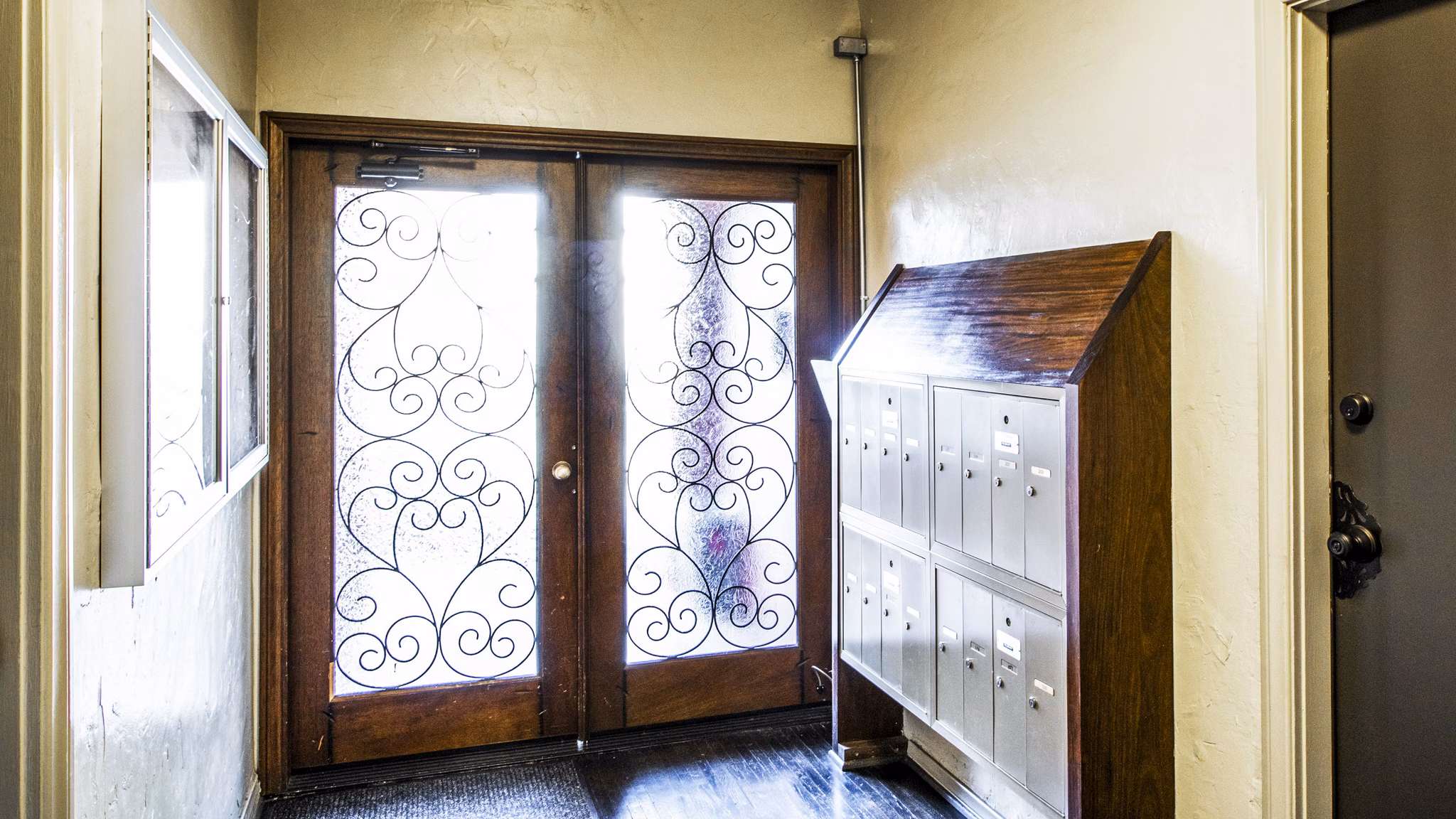 Main entrance with modern mailboxes at Delta Apartments, a luxury Greystar community
