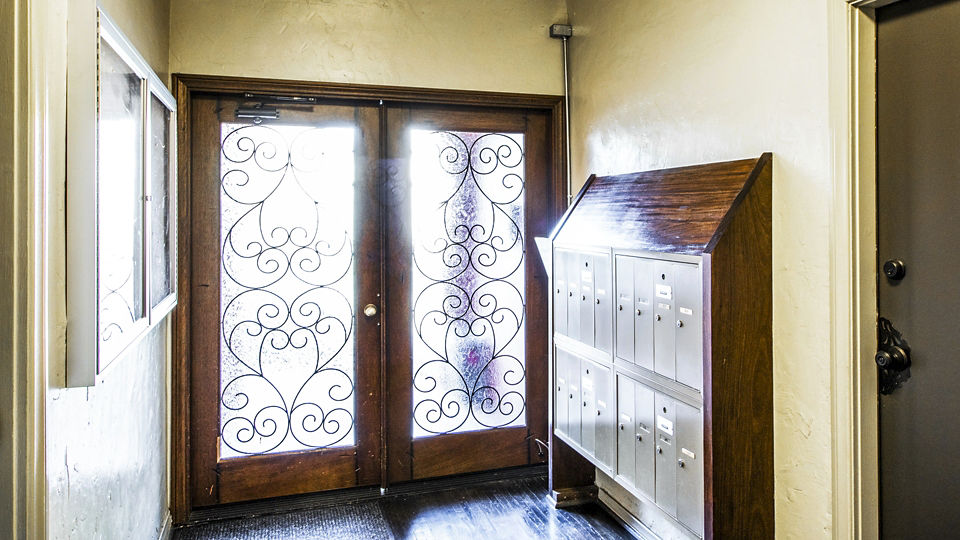 Main entrance with modern mailboxes at Delta Apartments, a luxury Greystar community