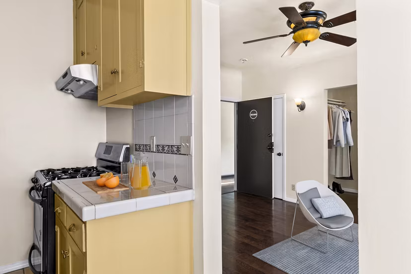 Modern kitchen with stainless steel appliances at Delta Apartments