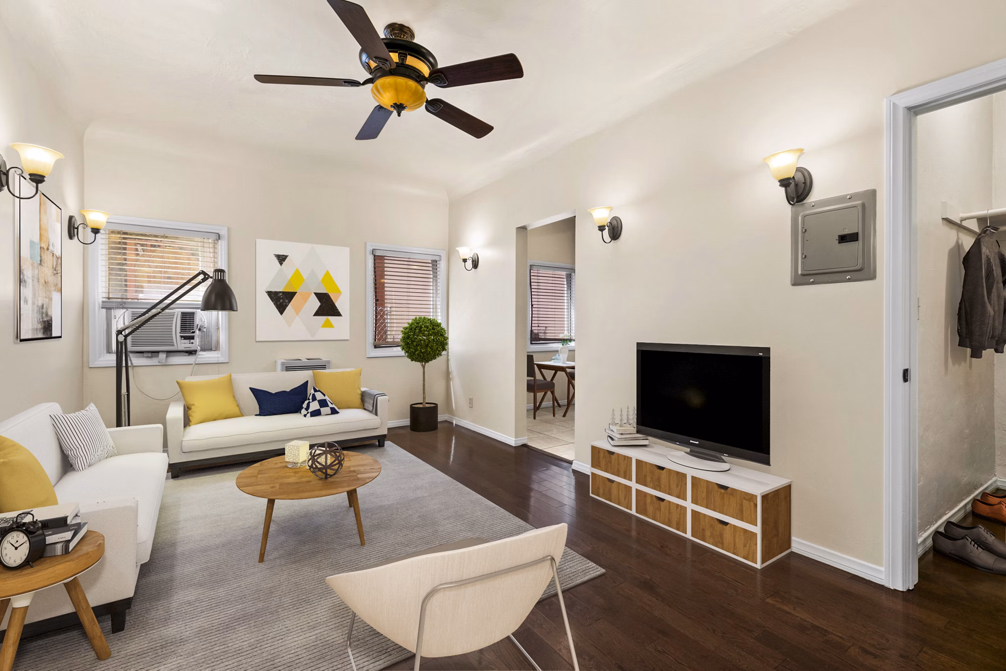 Spacious living room with modern decor in Delta Apartments, luxury Greystar property