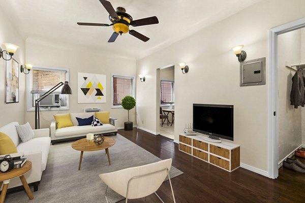 Spacious living room with modern decor in Delta Apartments, luxury Greystar property