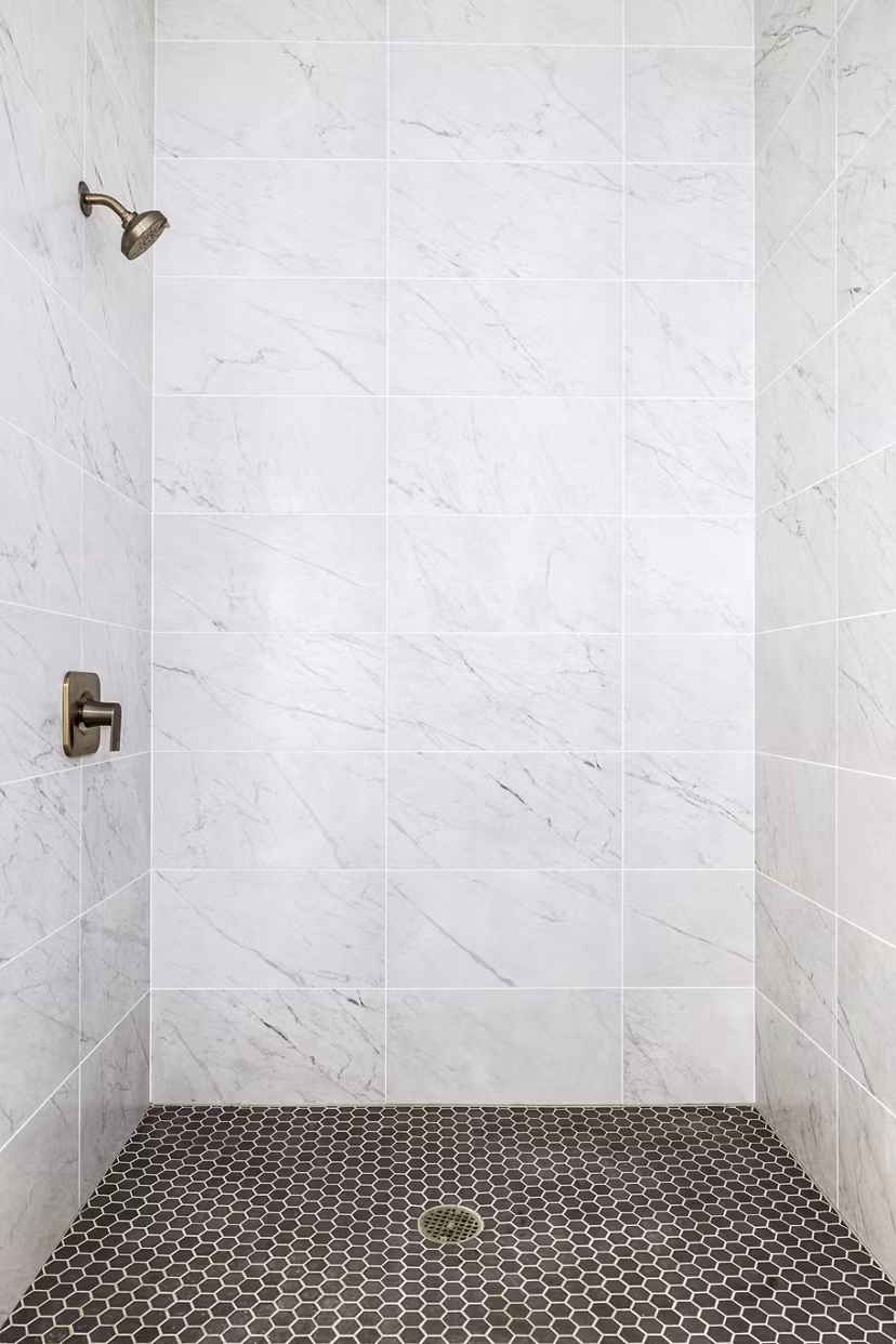 Bathroom featuring modern fixtures and marble countertops in Edendale Crossing Apartments