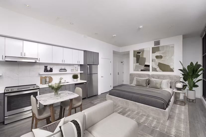 Studio apartment with living, dining, kitchen, and sleeping areas in Edendale Crossing Apartments, offering modern and efficient space utilization