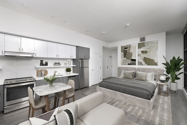 Studio apartment with living, dining, kitchen, and sleeping areas in Edendale Crossing Apartments, offering modern and efficient space utilization