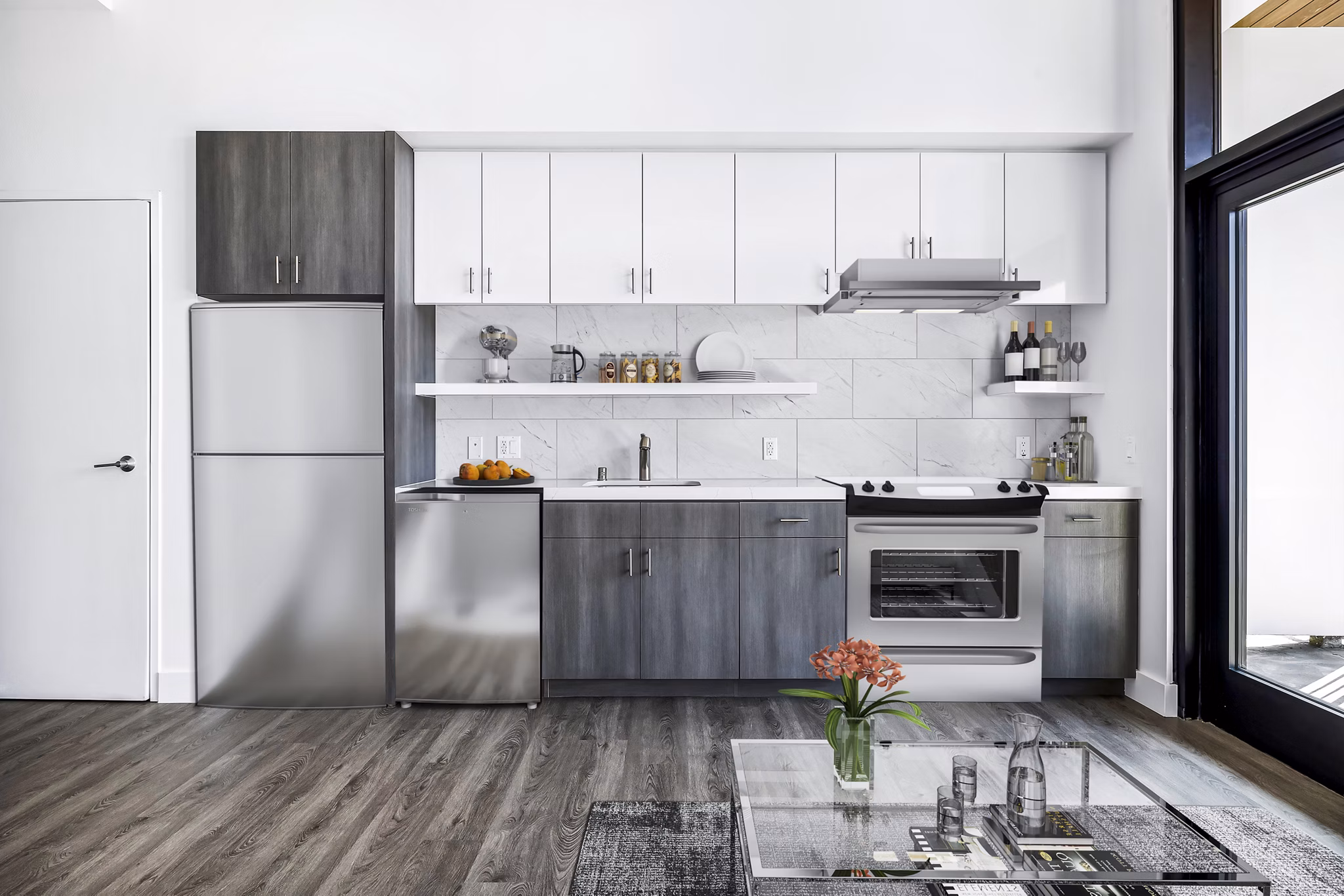 Modern kitchen featuring stainless steel appliances and granite countertops at Edendale Crossing Apartments