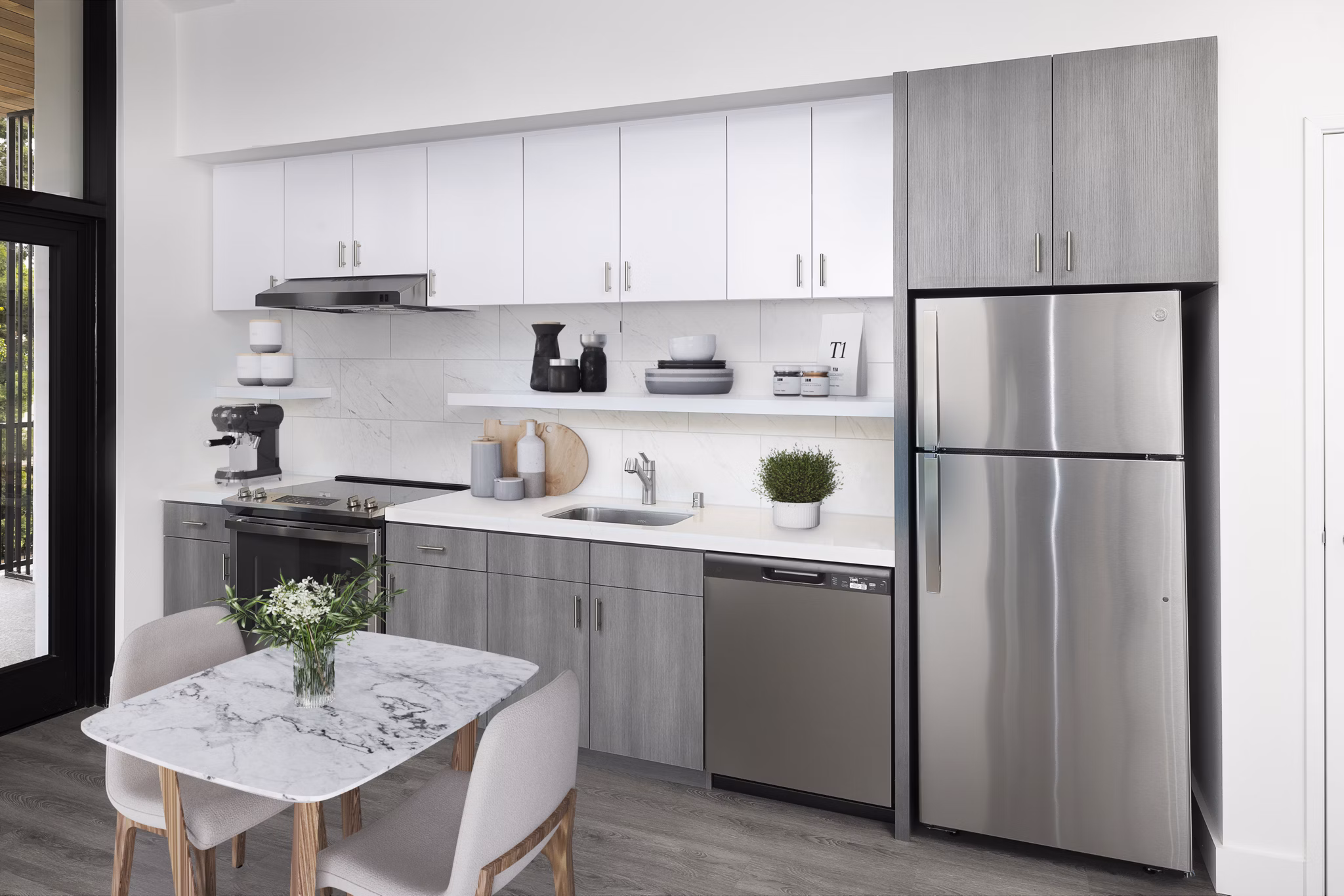 Dining and kitchen area with modern appliances at Edendale Crossing Apartments