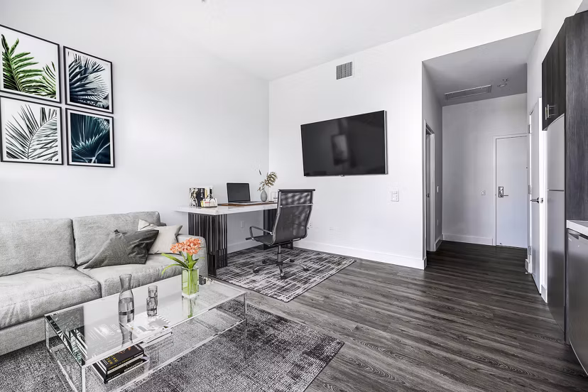 Compact studio home office and living room with modern furnishings at Edendale Crossing Apartments