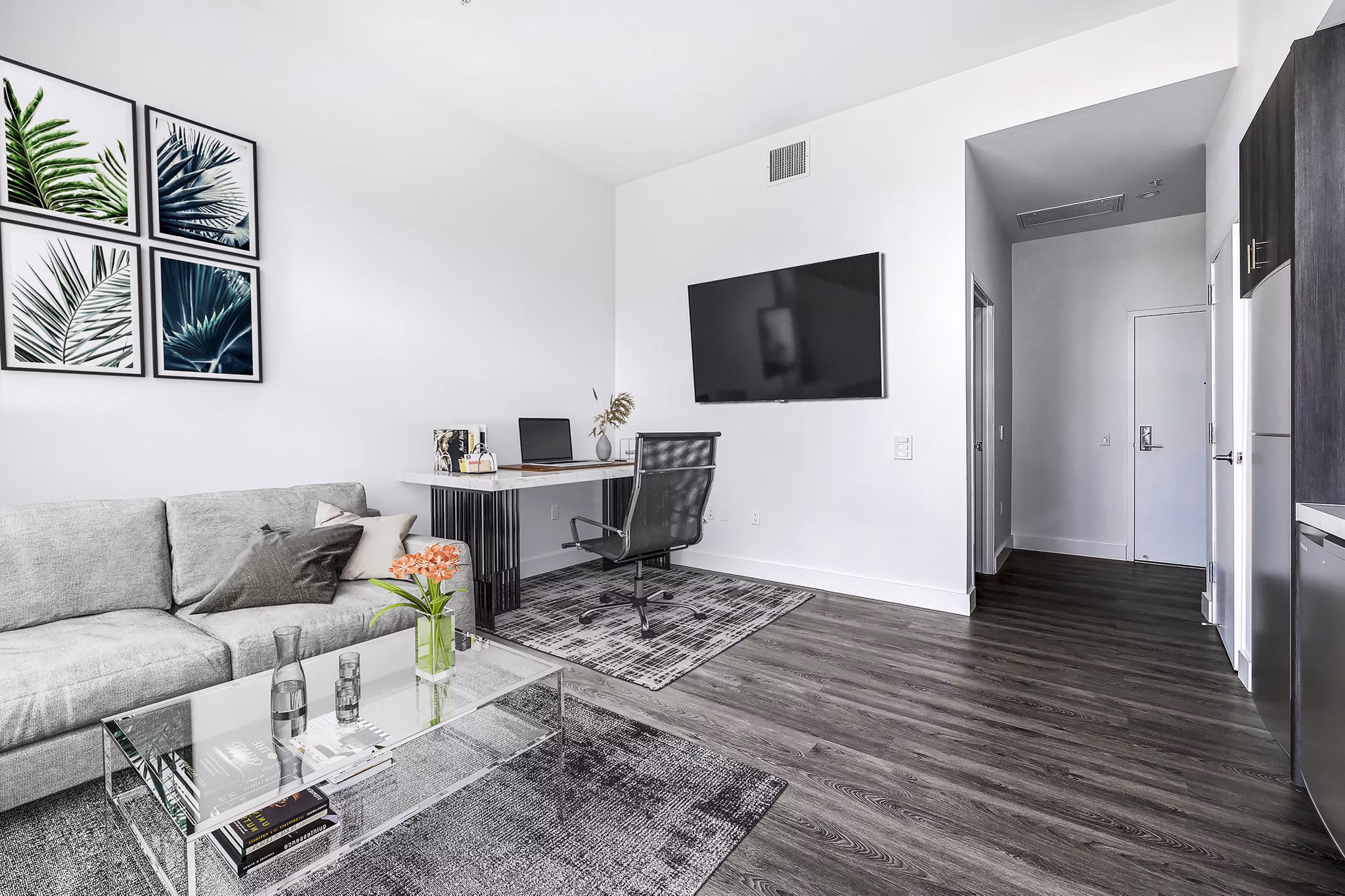Compact studio home office and living room with modern furnishings at Edendale Crossing Apartments