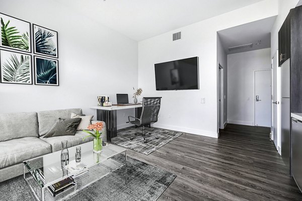 Compact studio home office and living room with modern furnishings at Edendale Crossing Apartments