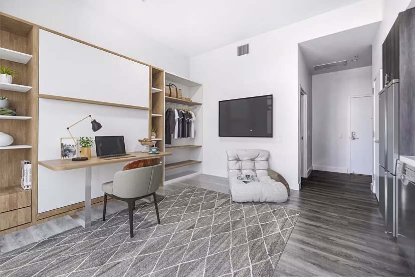 Studio living room with versatile home office at Edendale Crossing Apartments, showcasing modern luxury apartment design