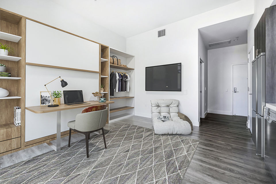 Studio living room with versatile home office at Edendale Crossing Apartments, showcasing modern luxury apartment design