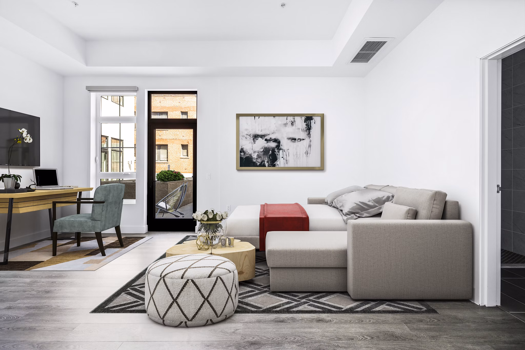 Studio bedroom/home office with modern furnishings at Edendale Crossing Apartments in a vibrant location
