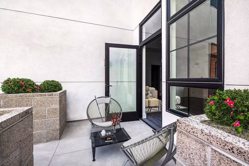Outdoor patio with modern seating and greenery at Edendale Crossing Apartments offering luxury living