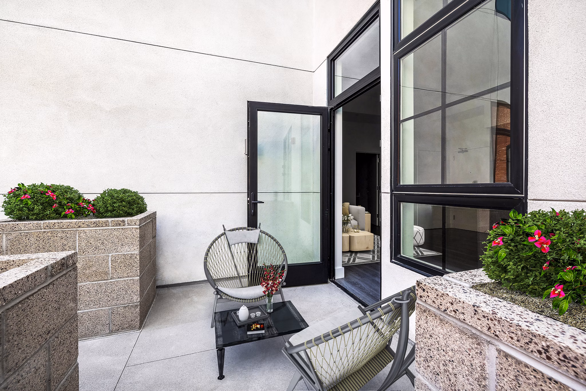Outdoor patio with modern seating and greenery at Edendale Crossing Apartments offering luxury living