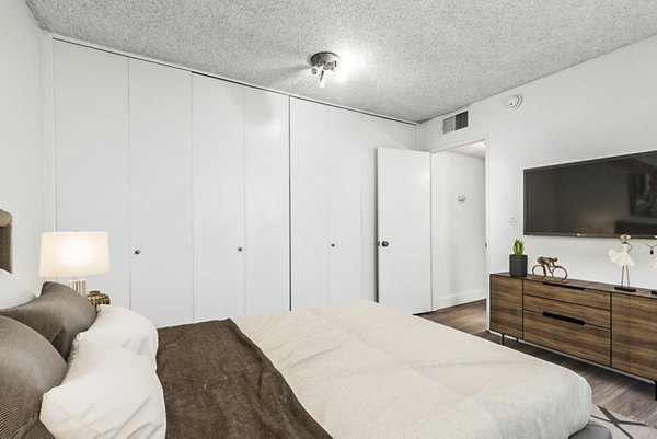 Cozy bedroom with stylish decor at The Fulton Apartments