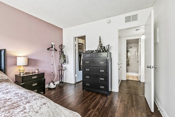 Elegant bedroom with modern decor at The Fulton Apartments in luxury Greystar community