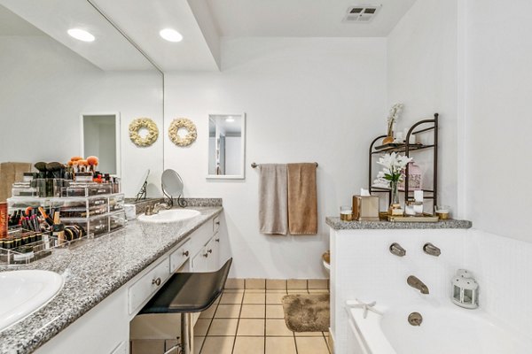 Modern bathroom featuring sleek fixtures and vanity at The Fulton Apartments luxury building in vibrant Greystar community