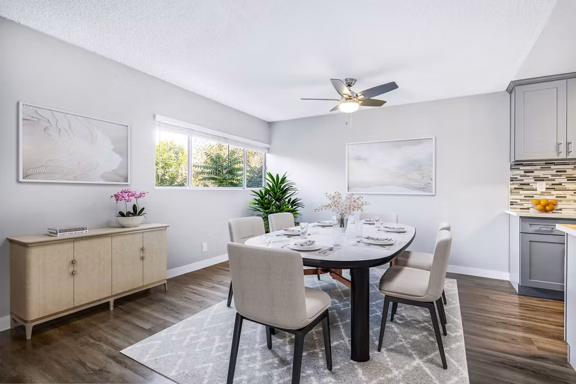 Elegant dining room with chic lighting and modern decor at The Fulton Apartments