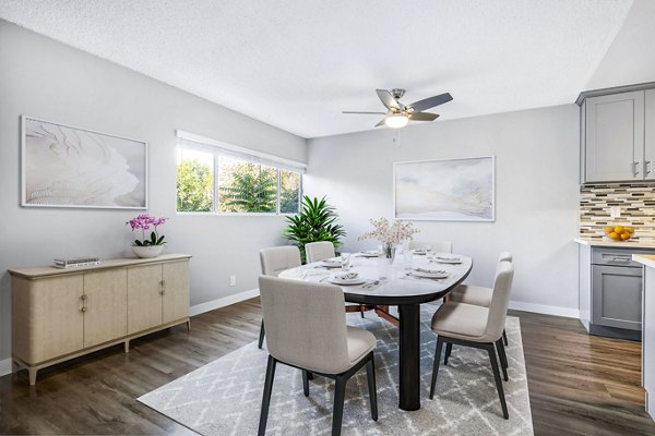 Elegant dining room with chic lighting and modern decor at The Fulton Apartments