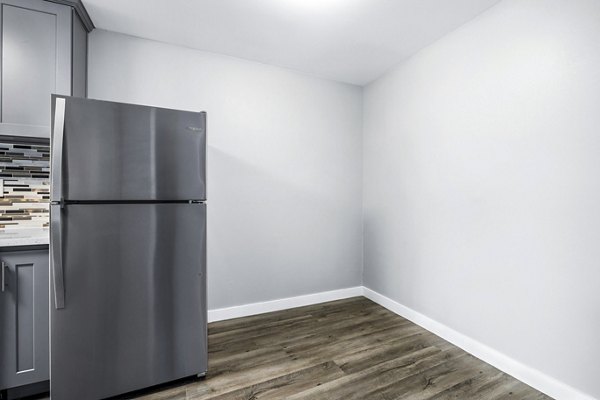 Dining room with elegant lighting and modern furnishings at The Fulton Apartments, luxury living in the heart of the city