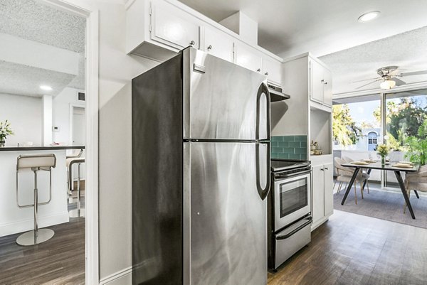 Modern kitchen with stainless steel appliances at The Fulton Apartments