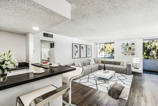 Living room featuring modern furnishings and stylish decor at The Fulton Apartments