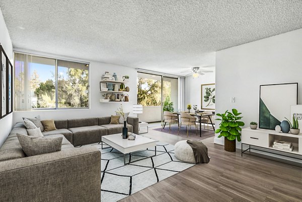 Modern living room in The Fulton Apartments with designer furnishings and natural light, offering premium Greystar luxury apartment living