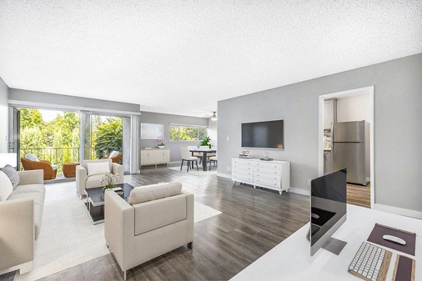 Spacious living room with modern decor in The Fulton Apartments, featuring luxury interiors for a comfortable living experience