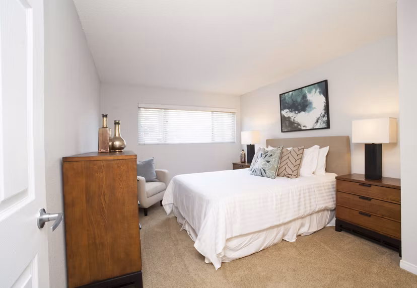 Modern bedroom with stylish furnishings at Milano Apartments, offering luxury living in a vibrant community